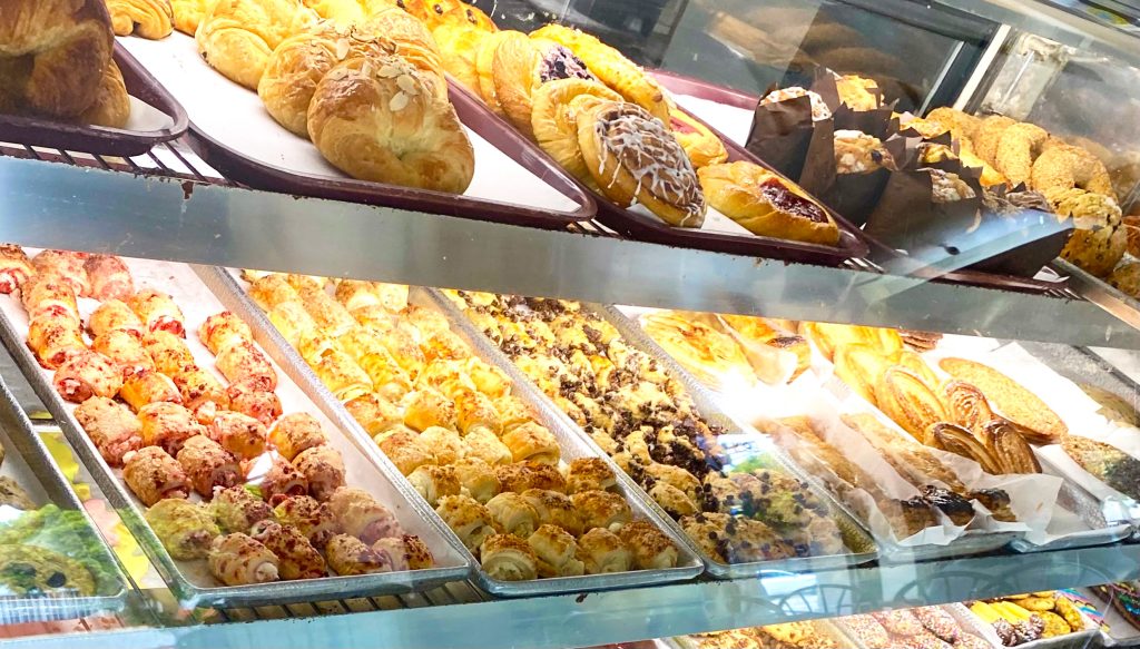 A pastry display case in a bakery in the US