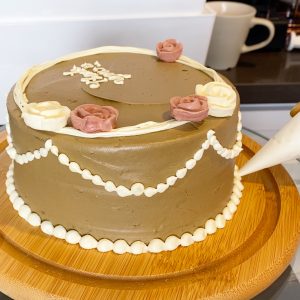 Piping butter cream on Hojicha cake