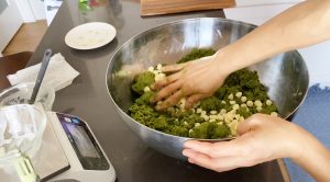 Fold in white chocolate chips to Matcha scone dough in a bowl
