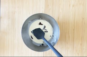 Boil heavy cream and pour into chocolate