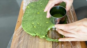 Cut Matcha scone dough into rounds with a cutter