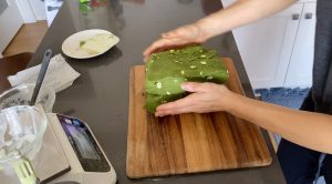 Cut Matcha scone dough into half and fold them
