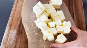 Cut butter into cubes
