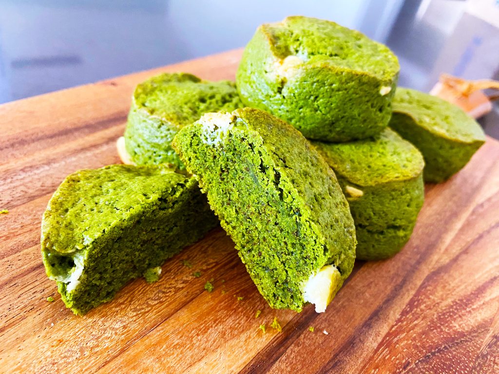 Matcha white chocolate scones on a wooden board