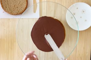 Spread ganache on the 3rd coffee sponge cake