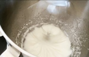 Whip egg whites and sugar in a bowl