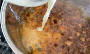 Add heavy cream to caramel