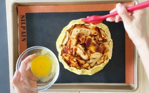 Brush egg wash on galette