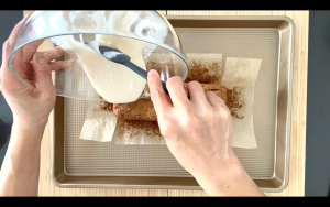 Pour sugar glaze on cake loaf