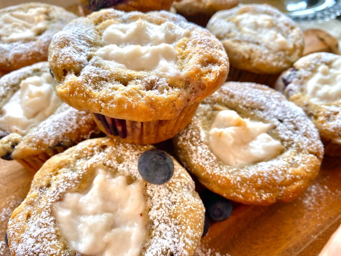 Vegan blueberry yogurt muffins with blueberries on top