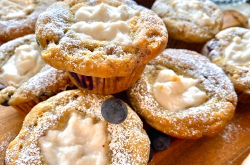 Vegan blueberry yogurt muffins with blueberries on top