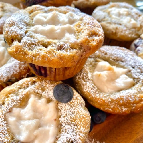Vegan blueberry yogurt muffins with blueberries on top