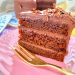 Vegan double chocolate ganache cake with olive oil on a pink plate