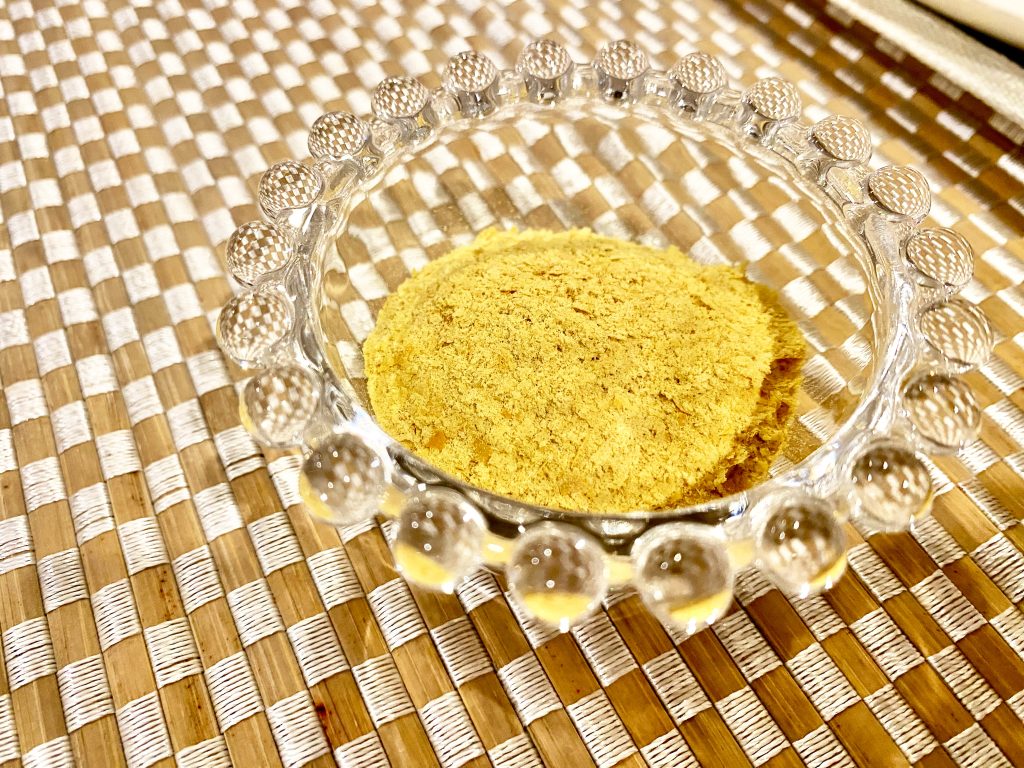 Nutritional yeast in a glass bowl Nutritional yeast in a glass bowl