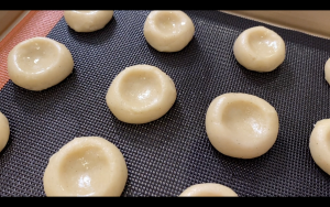 Grease fingers if the cookie dough is too sticky