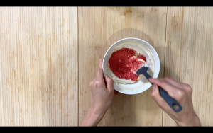 Mix vegan white chocolate and freeze dried strawberries