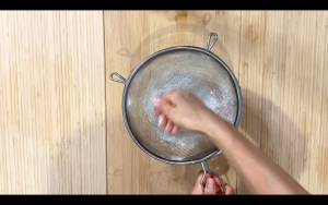Sift powdered sugar