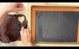 Cut out cookie dough and place on baking sheet