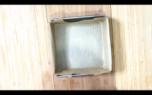 Line a square pan with parchment paper