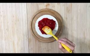 Place the strawberry compote on the cheese cake