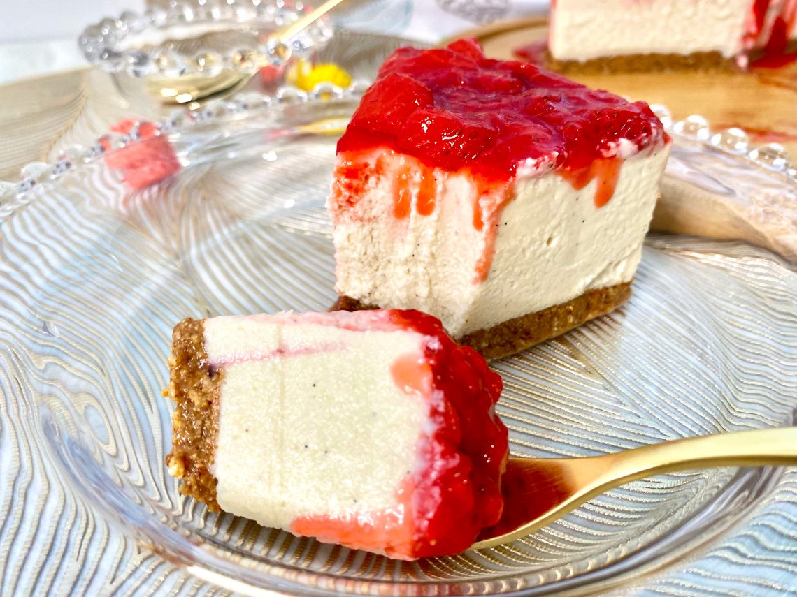 Vegan gluten-free strawberry cheesecake with a fork