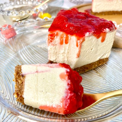 Vegan gluten-free strawberry cheesecake with a fork